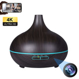 Elegant ultrasonic aroma diffuser with hidden HD WiFi camera and 7-color ambient lighting.