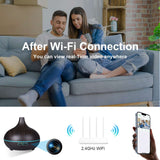Couple enjoying relaxing atmosphere with ultrasonic aroma diffuser and hidden WiFi camera, showcasing real-time video feature.
